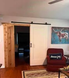 a living room with furniture and a rug