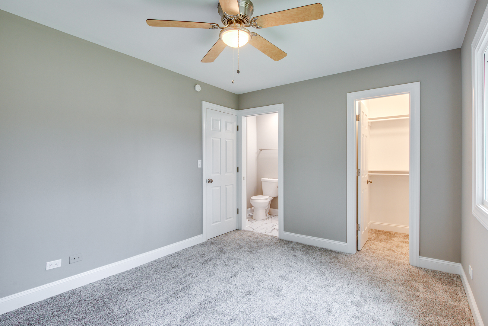 106 Foxcroft Road Naperville, IL 60565 - Photo 15 of 21 an empty room with closet and a chandelier fan