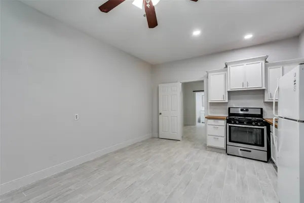 a kitchen with stainless steel appliances a stove and a refrigerator