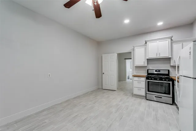 a kitchen with stainless steel appliances a stove and a refrigerator