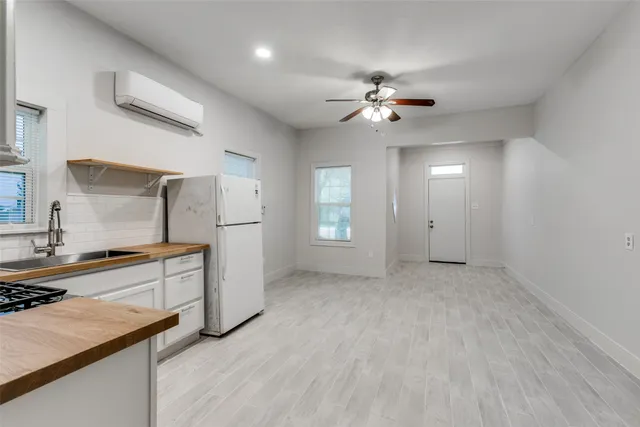 a view of a kitchen with a sink and a stove