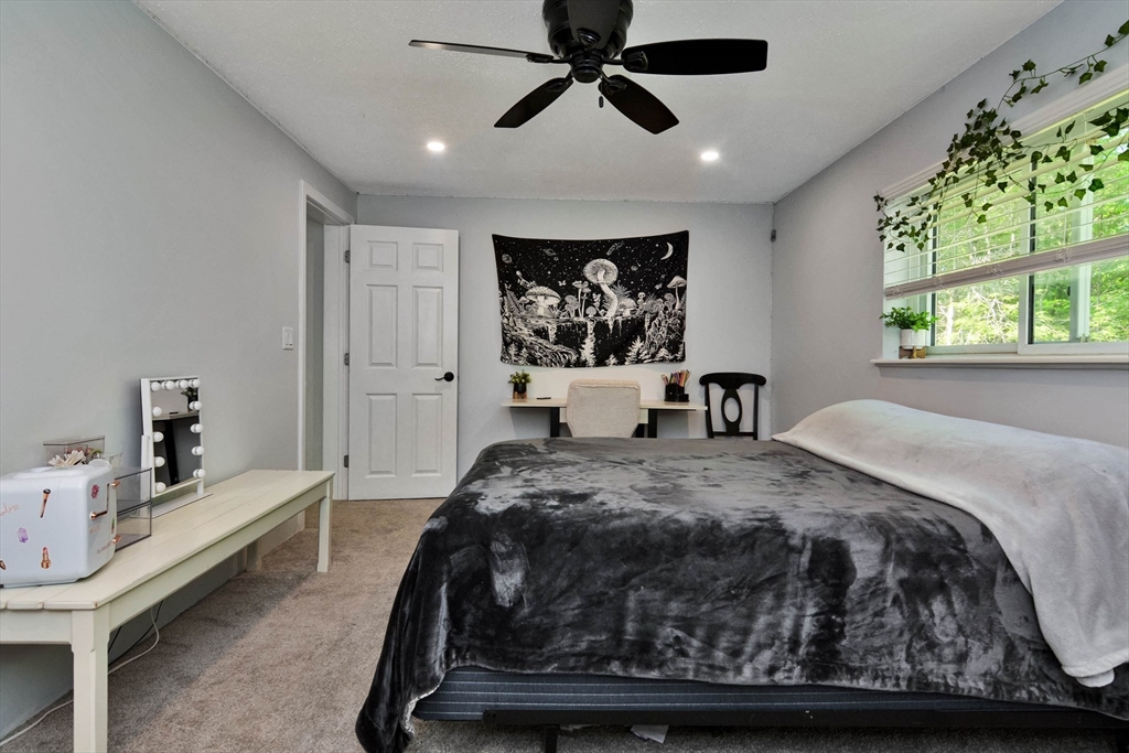 110 Harper Ridge Road Hampstead, NH 03826 - Photo 22 of 32 a bed room with a bed and a window
