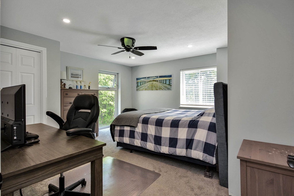 110 Harper Ridge Road Hampstead, NH 03826 - Photo 23 of 32 a bedroom with a bed window and a desk