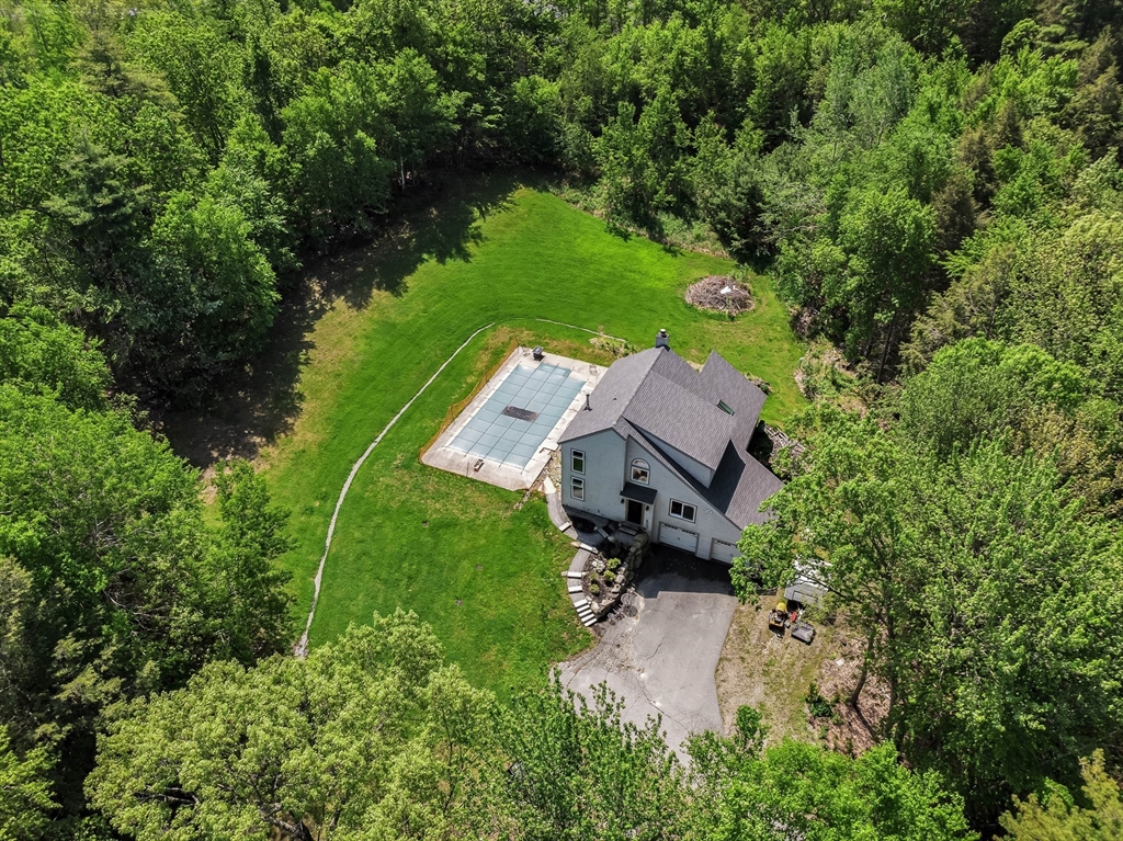 110 Harper Ridge Road Hampstead, NH 03826 - Photo 30 of 32 an aerial view of a house with yard and outdoor seating