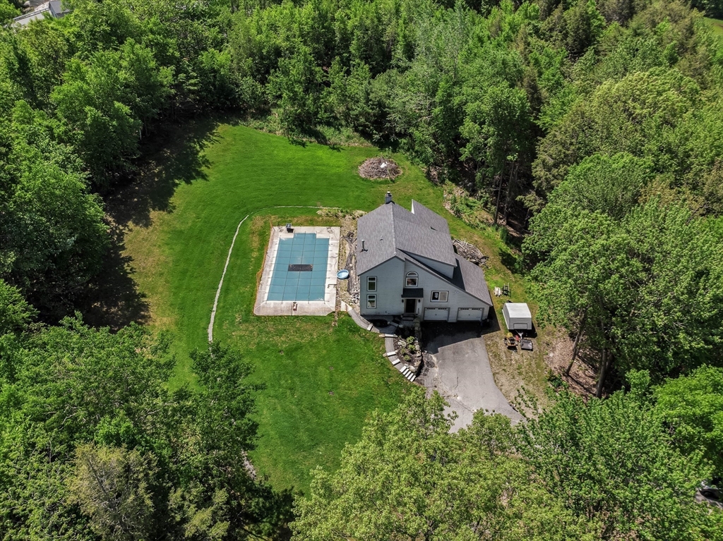 110 Harper Ridge Road Hampstead, NH 03826 - Photo 31 of 32 an aerial view of a house with swimming pool and garden