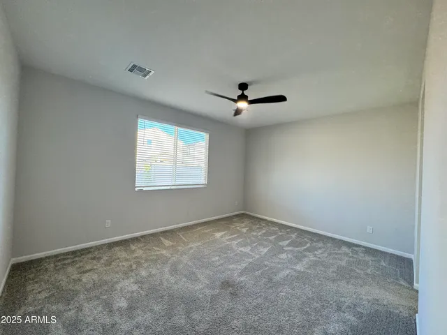 a bathroom with a granite countertop sink mirror and shower