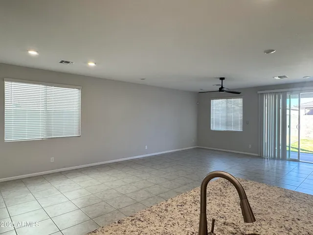 a kitchen with kitchen island sink stove and refrigerator