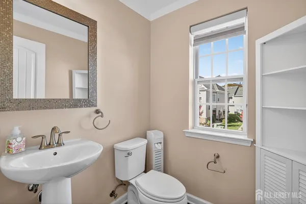a view of an empty room and a ceiling fan