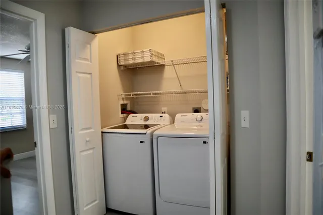 a utility room with dryer and washer