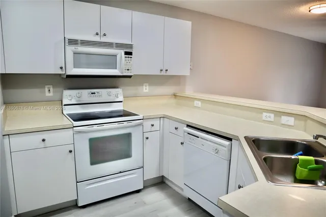 a kitchen with a stove and a microwave