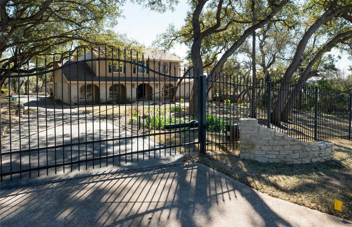 a view of a yard with large trees