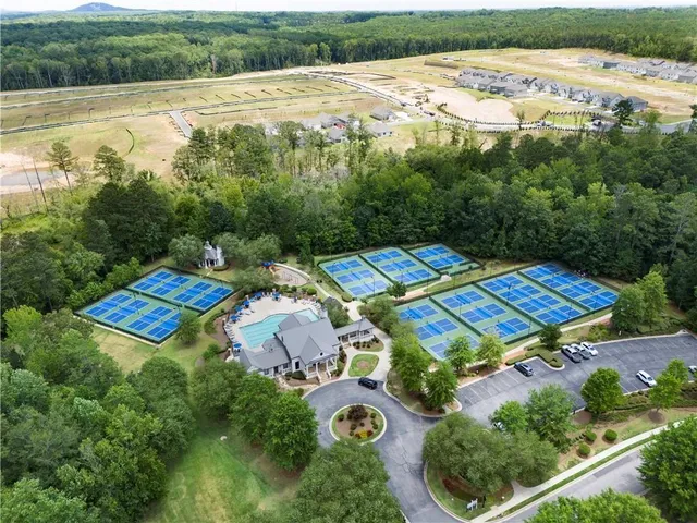 swimming pool view with a garden space