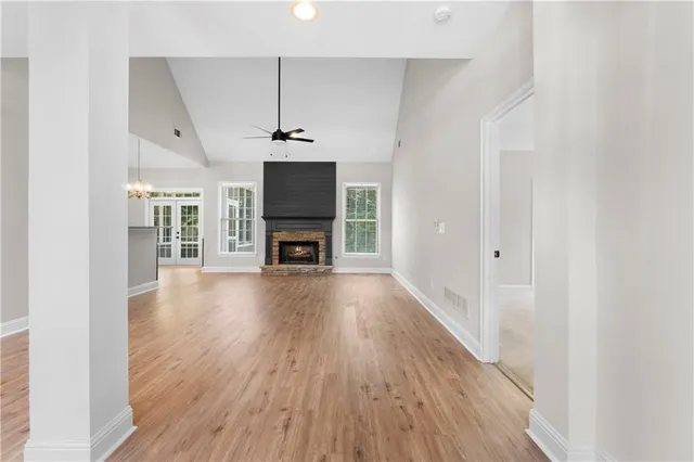 a view of main area with wooden floor fireplace