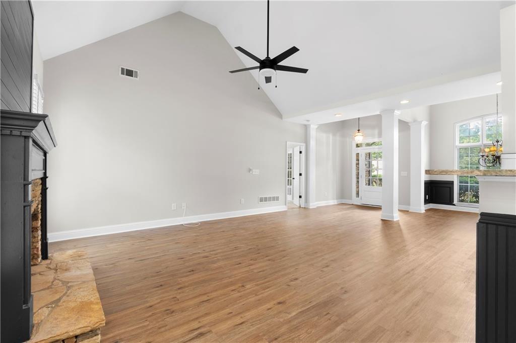 65 Riverwood View Dallas, GA 30157 - Photo 4 of 11 a view of a livingroom with a fireplace a ceiling fan and wooden floor
