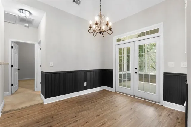 a view of a livingroom with a hardwood floor and a ceiling fan