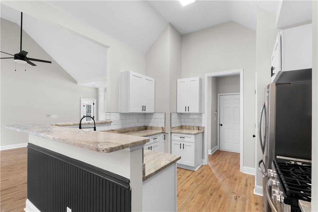 65 Riverwood View Dallas, GA 30157 - Photo 6 of 11 a kitchen with a sink stove and refrigerator