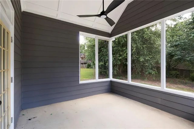 a view of room with window and front door