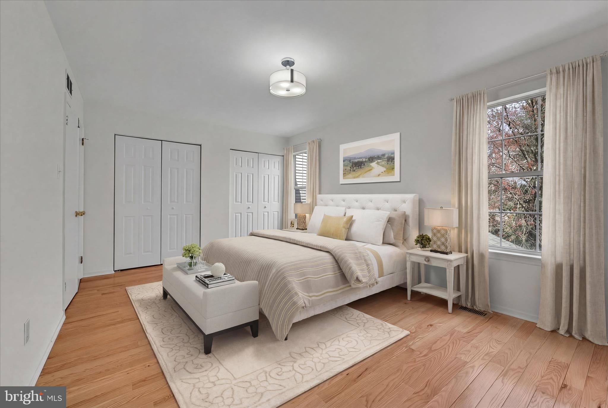 169 Judy Way Aston, PA 19014 - Photo 20 of 43 a spacious bedroom with a bed and wooden floor