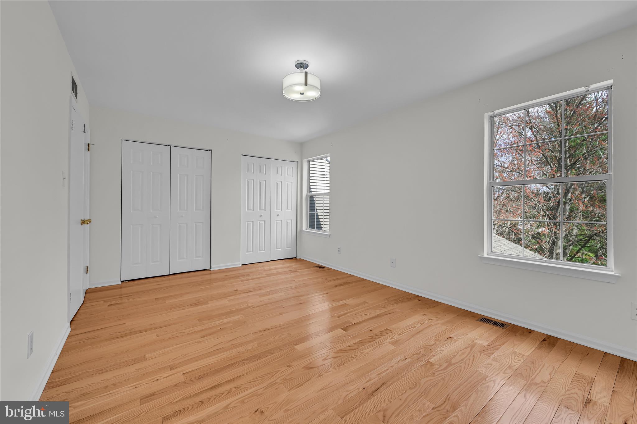 169 Judy Way Aston, PA 19014 - Photo 21 of 43 a view of an empty room with wooden floor and a window