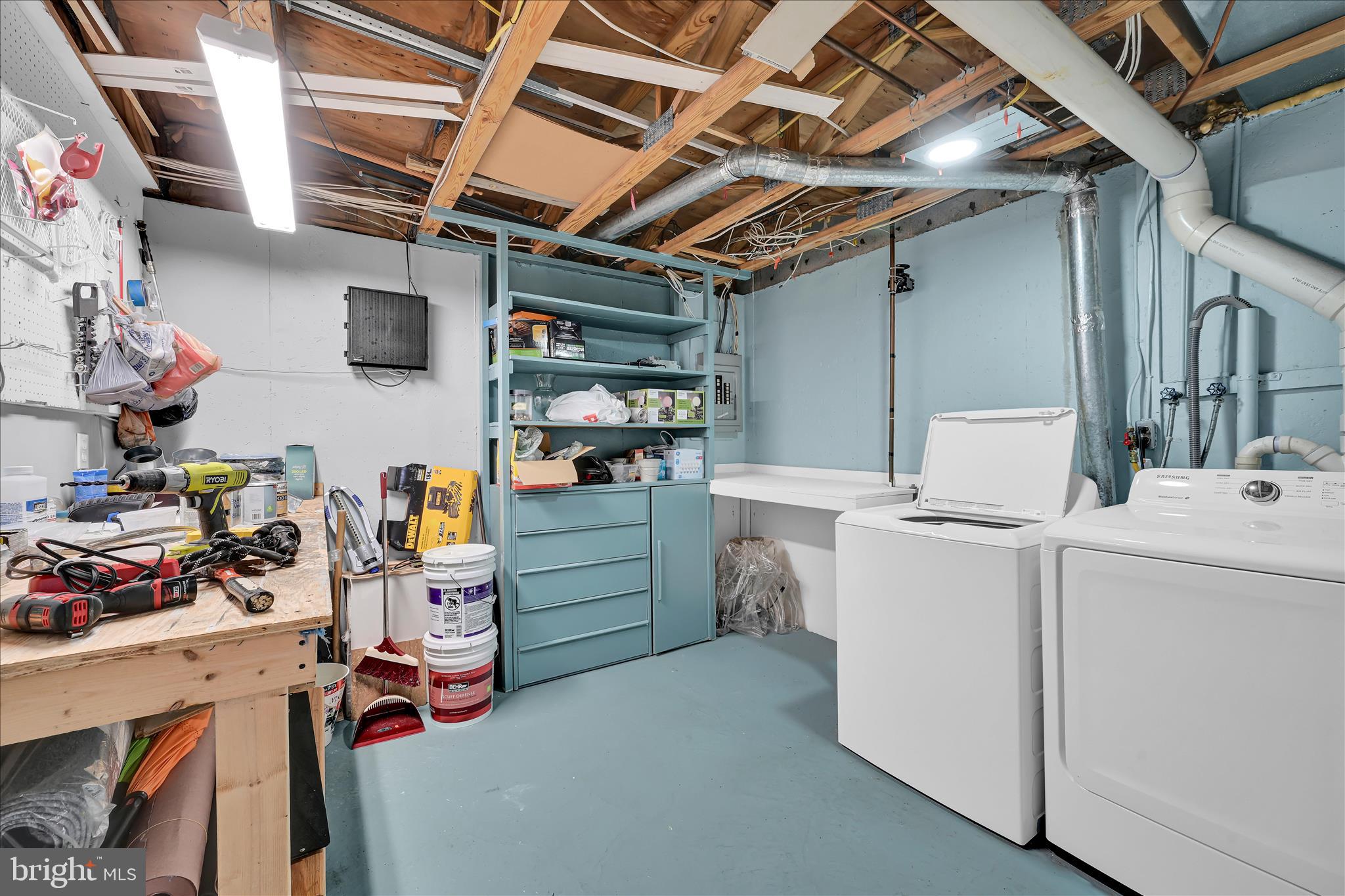 169 Judy Way Aston, PA 19014 - Photo 31 of 43 a storage room with washer and dryer