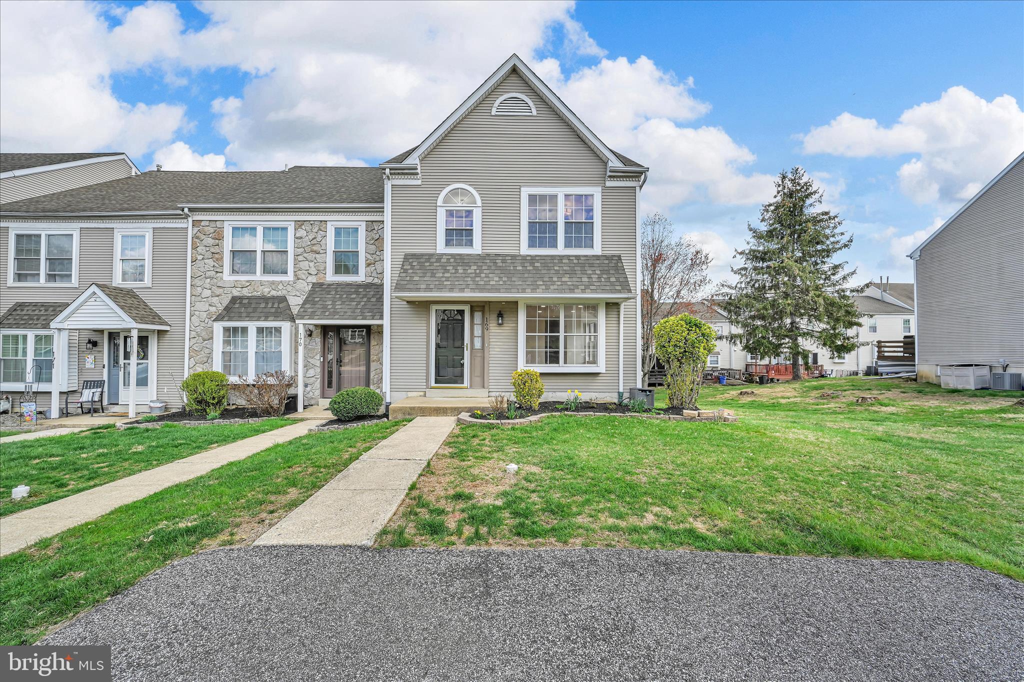 169 Judy Way Aston, PA 19014 - Photo 5 of 43 a front view of a house with a yard