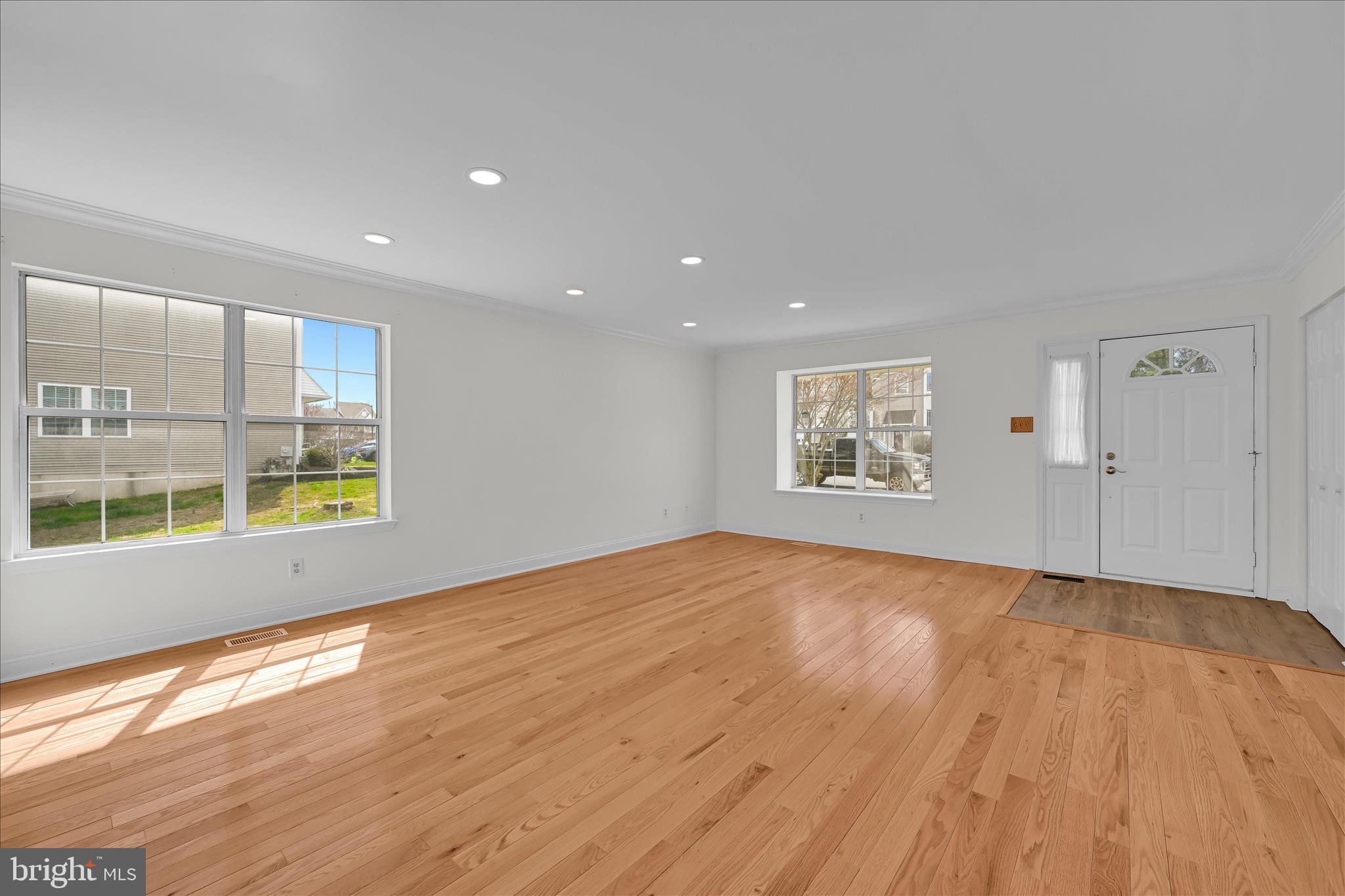 169 Judy Way Aston, PA 19014 - Photo 8 of 43 a view of an empty room with a window and wooden floor