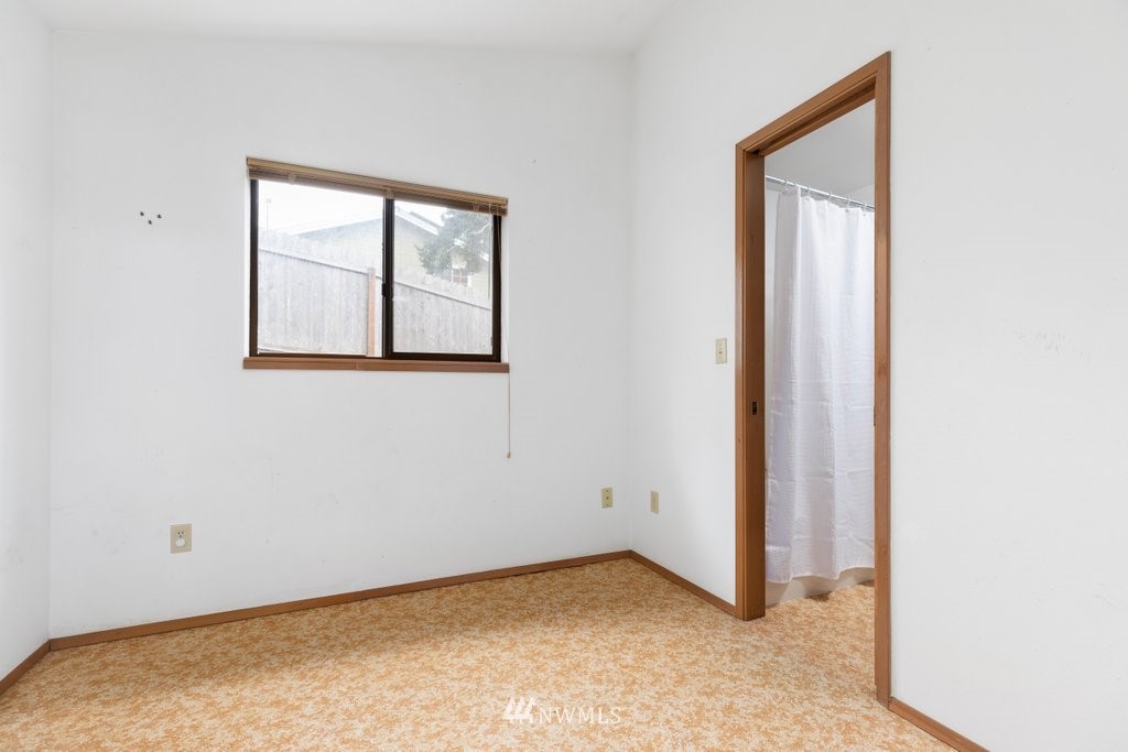 3769 Periwinkle Road Clinton, WA 98236 - Photo 11 of 29 an empty room with windows