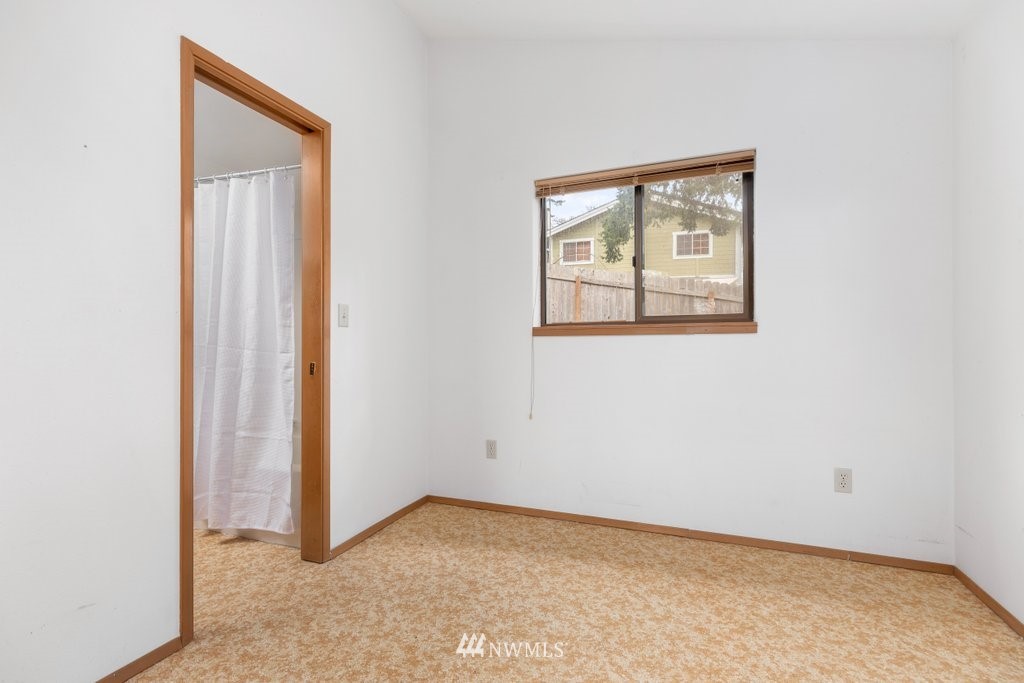 3769 Periwinkle Road Clinton, WA 98236 - Photo 12 of 29 an empty room with a window