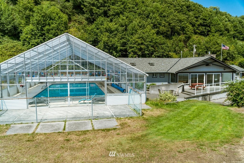 3769 Periwinkle Road Clinton, WA 98236 - Photo 27 of 29 a front view of a house with garden