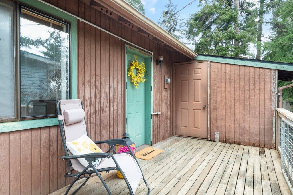 3769 Periwinkle Road Clinton, WA 98236 - Photo 4 of 29 a view of a deck with wooden cabinets and outdoor space