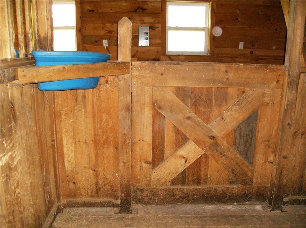 489 Smithfield Road Belgrade, ME 04917 - Photo 28 of 34 Inside stall looking toward isle....
