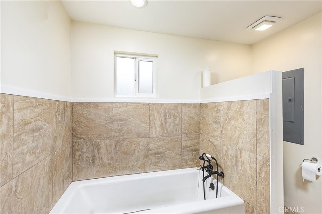 44000 Sandstone Road Aguanga, CA 92536 - Photo 16 of 31 a bathroom with a bathtub and shower