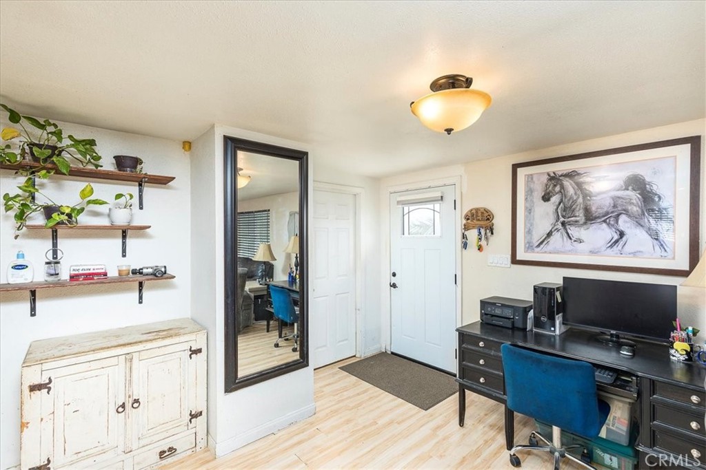 44000 Sandstone Road Aguanga, CA 92536 - Photo 6 of 31 a view of a workspace with furniture and wooden floor