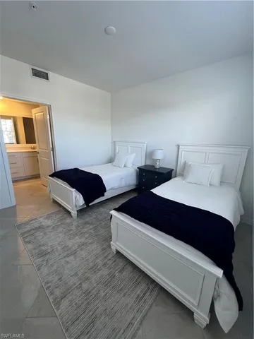 a front view of a house with a garden and outdoor seating