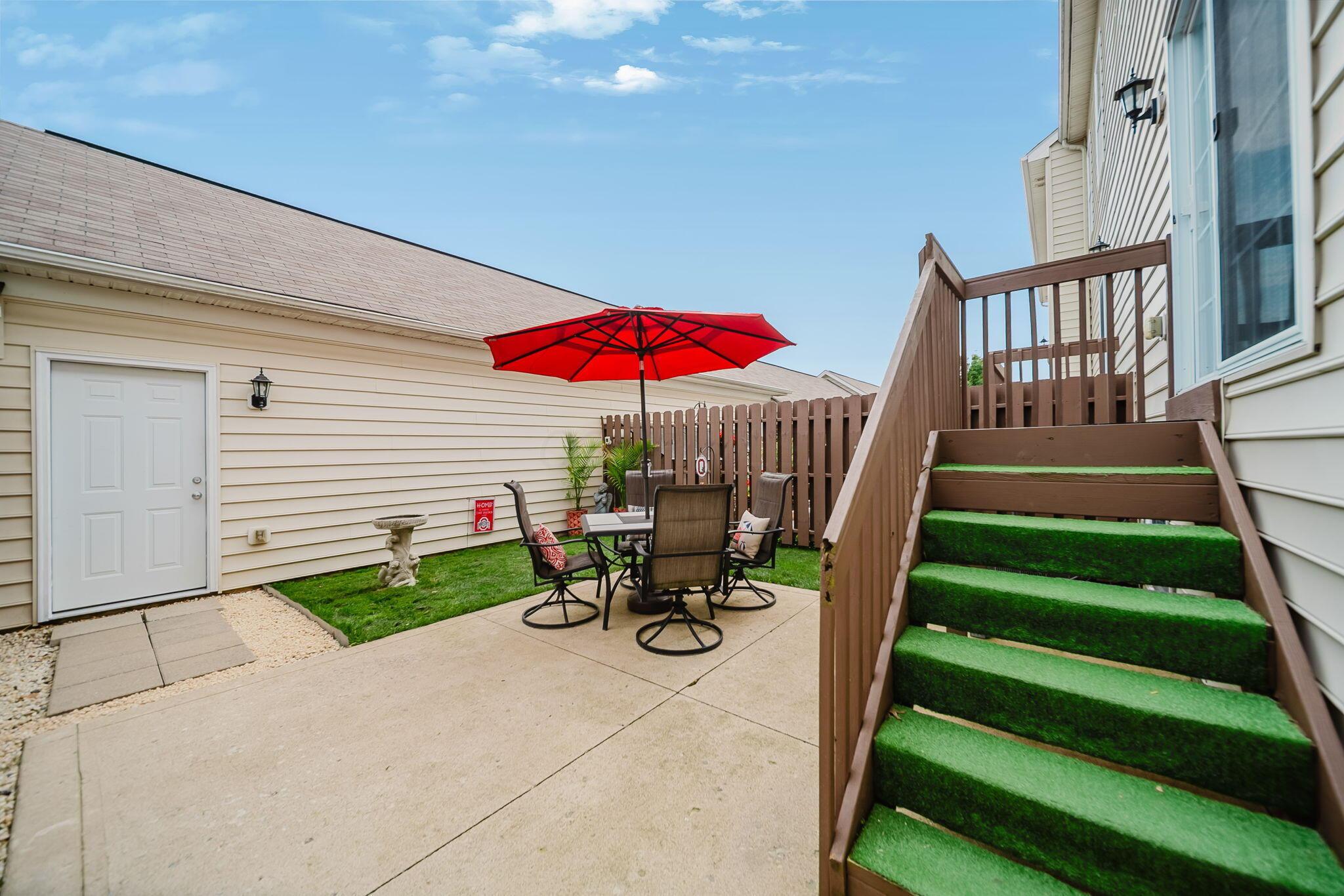6186 Needletail Road, Unit 66 Columbus, OH 43230 - Photo 31 of 48 Backyard is fenced and boasts a nice concrete patio; perfect for an evening meal and grilling out!