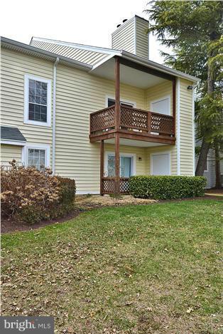 10031 Oakton Terrace Road, Unit 10031 Oakton, VA 22124 - Photo 11 of 19 a front view of a house with garden