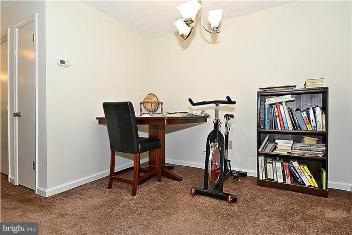 10031 Oakton Terrace Road, Unit 10031 Oakton, VA 22124 - Photo 15 of 19 a view of a room with gym equipment