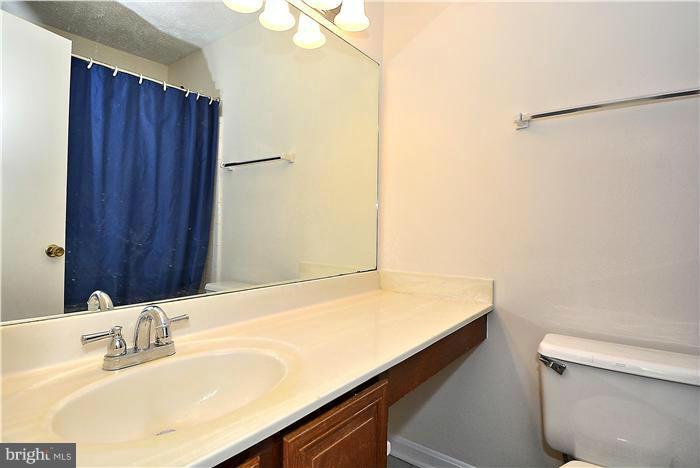 10031 Oakton Terrace Road, Unit 10031 Oakton, VA 22124 - Photo 16 of 19 a bathroom with a sink and a toilet
