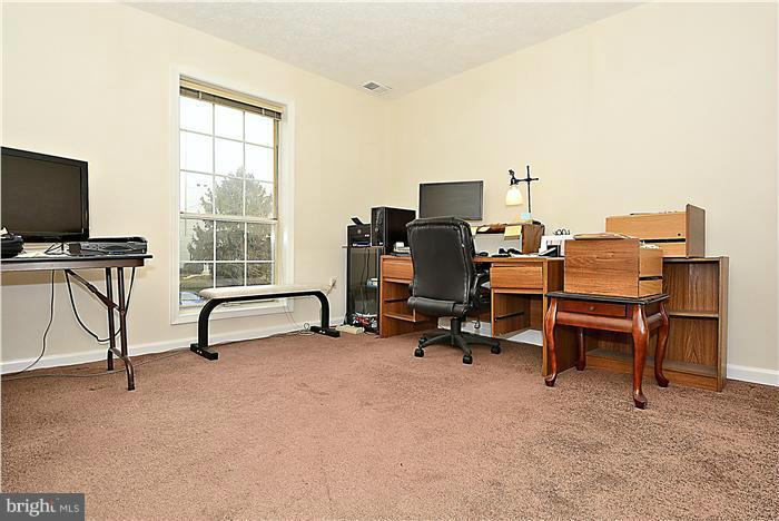 10031 Oakton Terrace Road, Unit 10031 Oakton, VA 22124 - Photo 8 of 19 a view of a workspace with furniture and a window