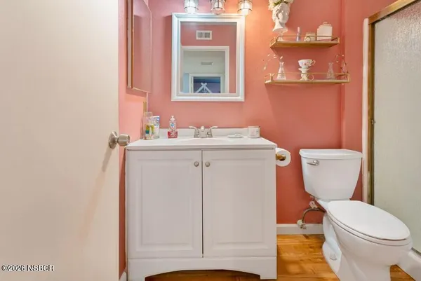 a bedroom with a bed a window and a walk in closet