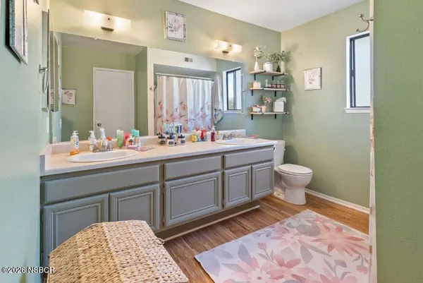 a bathroom with a sink vanity and a mirror