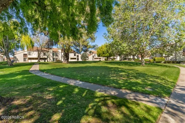 a view of a building with a yard