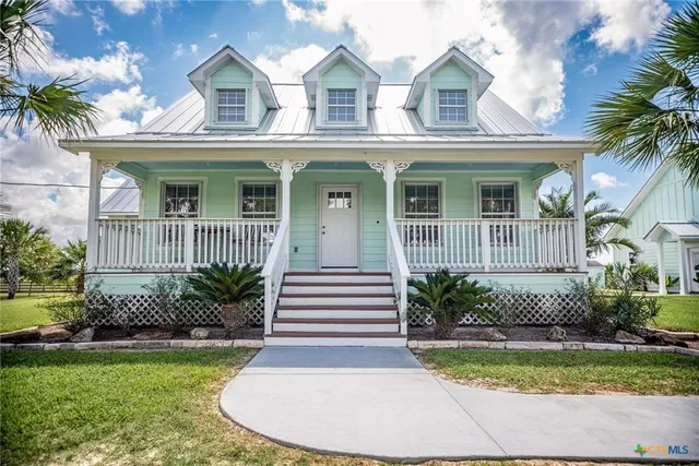front view of a house with a garden