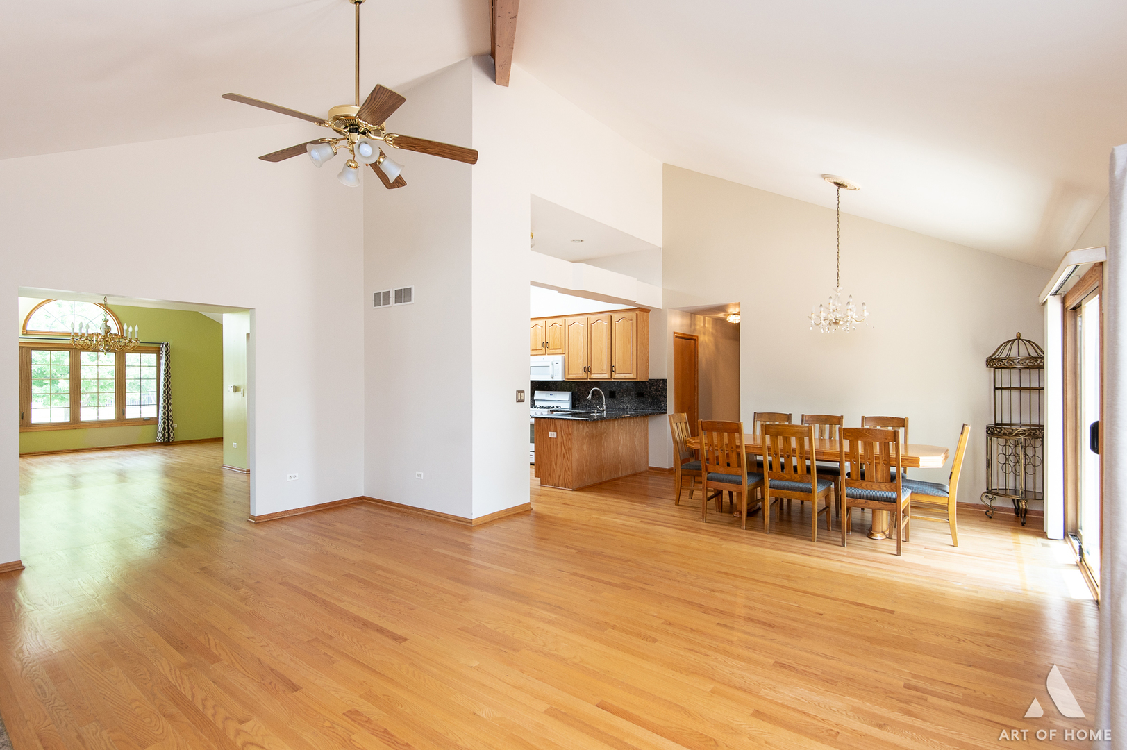 1196 Covington Drive Lemont, IL 60439 - Photo 11 of 52 a view of a room with kitchen view and a wooden floor
