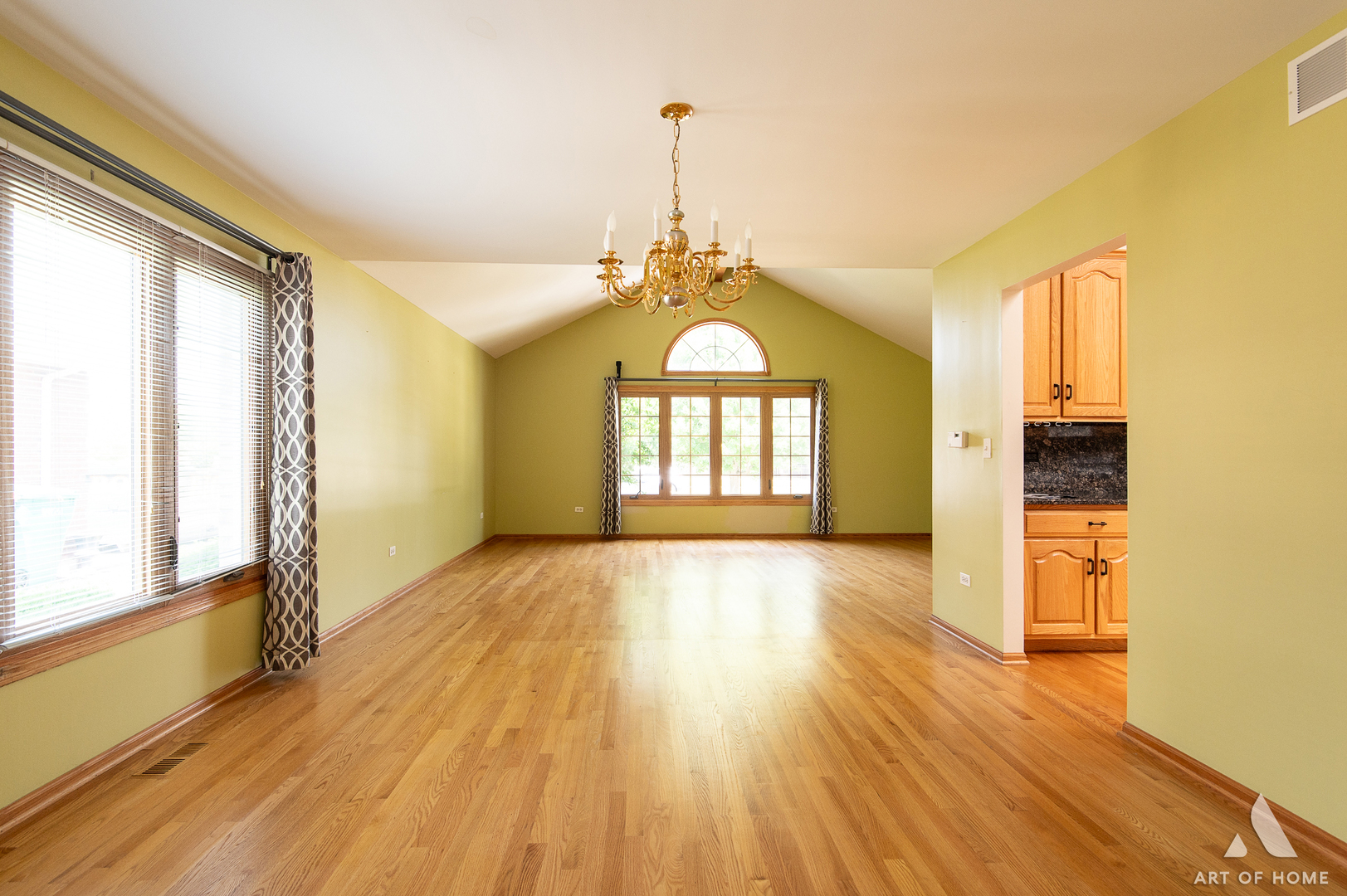 1196 Covington Drive Lemont, IL 60439 - Photo 16 of 52 a view of an empty room with a window and wooden floor