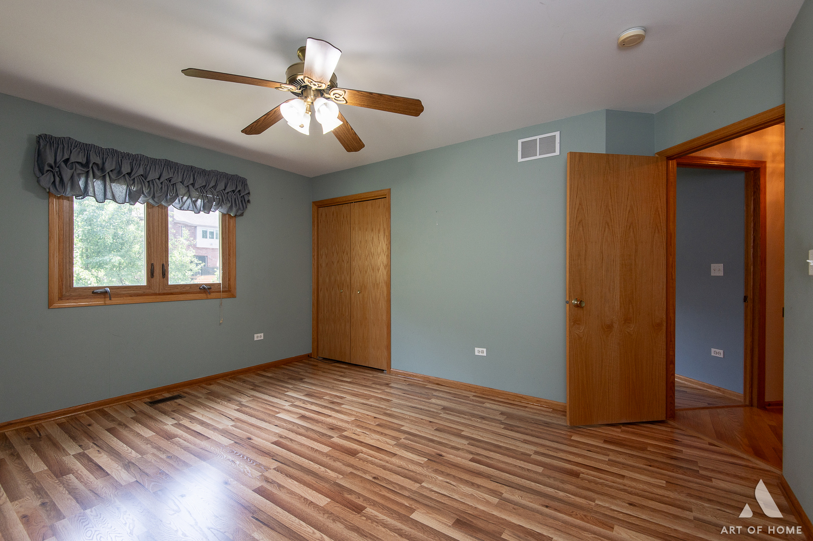 1196 Covington Drive Lemont, IL 60439 - Photo 30 of 52 a view of an empty room with window and wooden floor