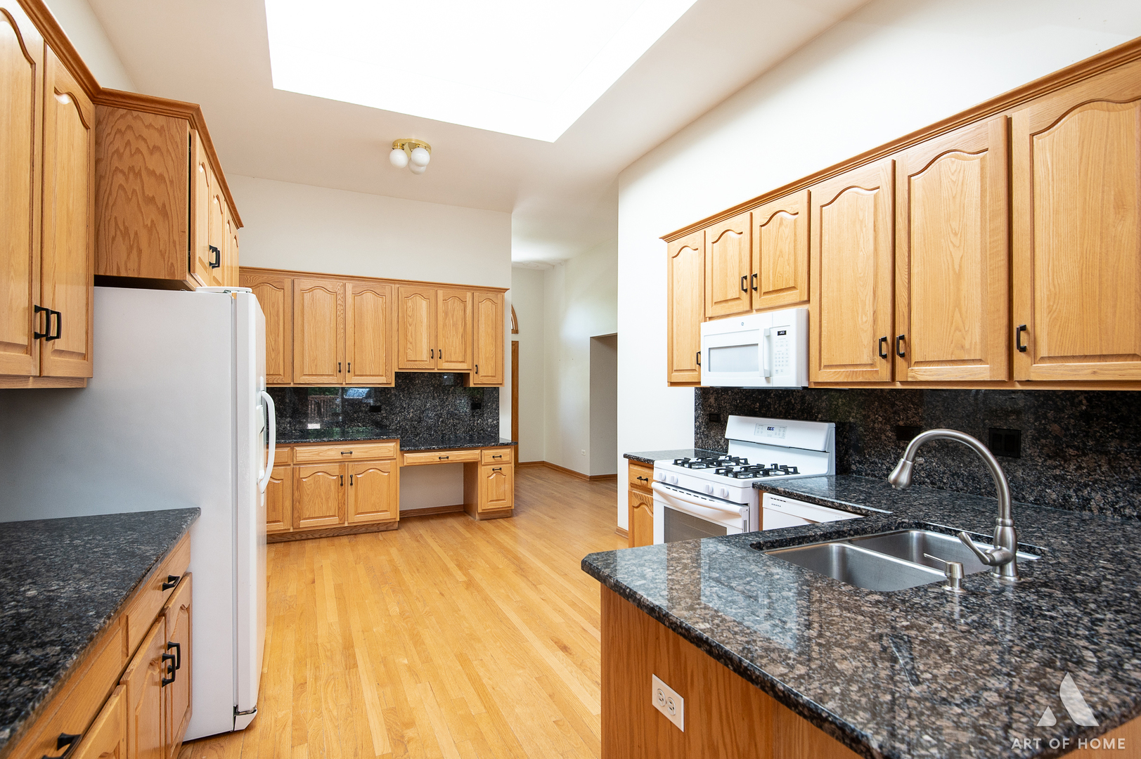 1196 Covington Drive Lemont, IL 60439 - Photo 8 of 52 a kitchen with stainless steel appliances granite countertop a sink a stove and a wooden cabinets