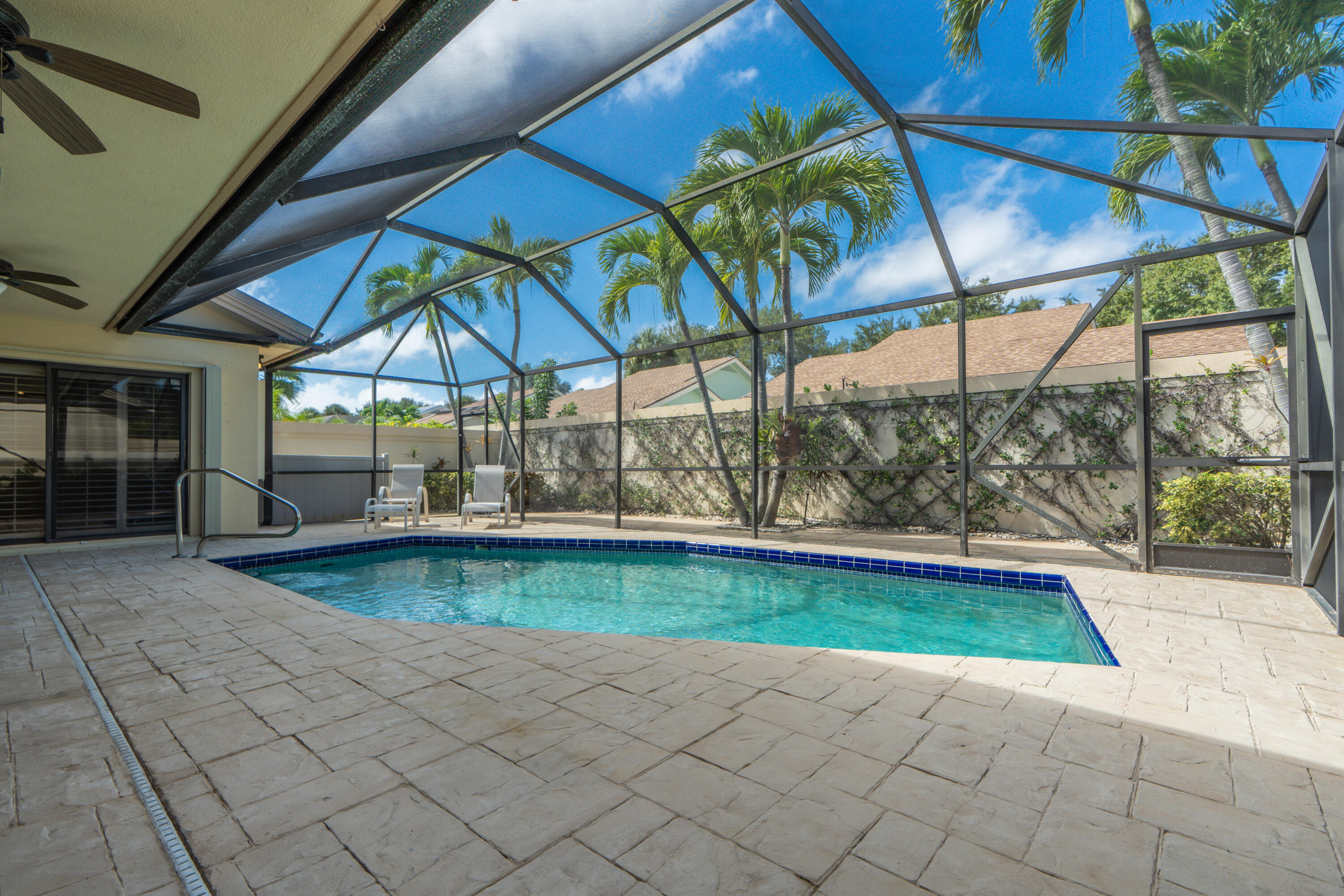 422 River Edge Road Jupiter, FL 33477 - Photo 12 of 39 a view of a backyard with sitting area and furniture