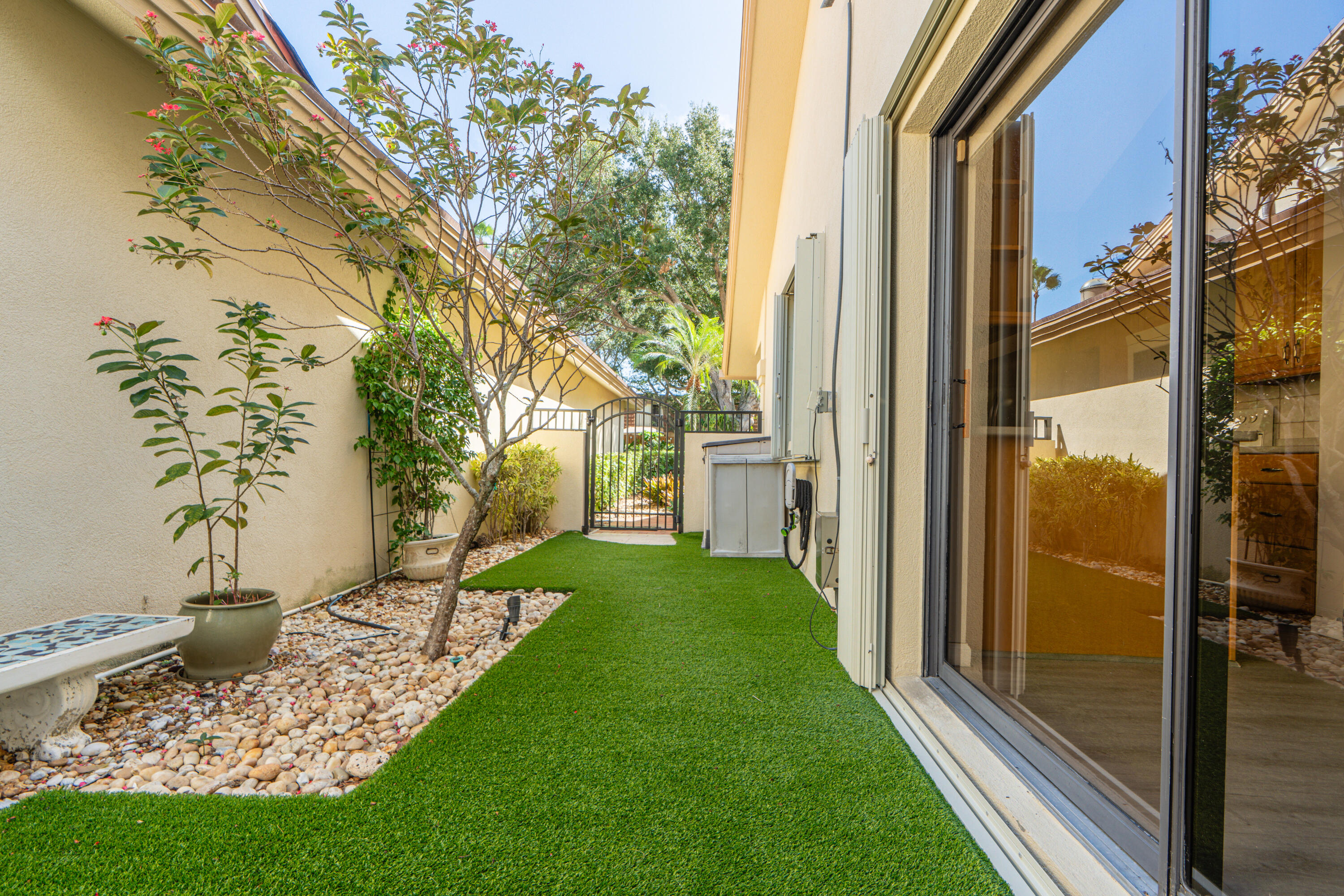 422 River Edge Road Jupiter, FL 33477 - Photo 13 of 39 a view of a porch with a yard