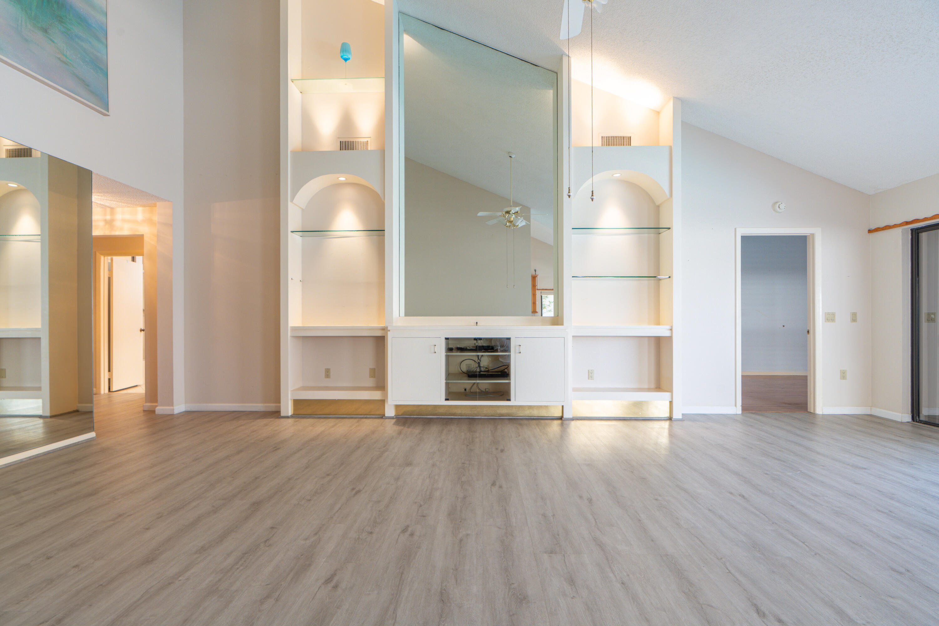 422 River Edge Road Jupiter, FL 33477 - Photo 17 of 39 a view of empty room with wooden floor and fireplace